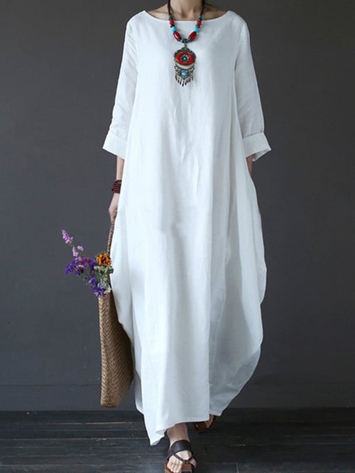 Damska sukienka midi z podkreśloną talią i prostym krojem